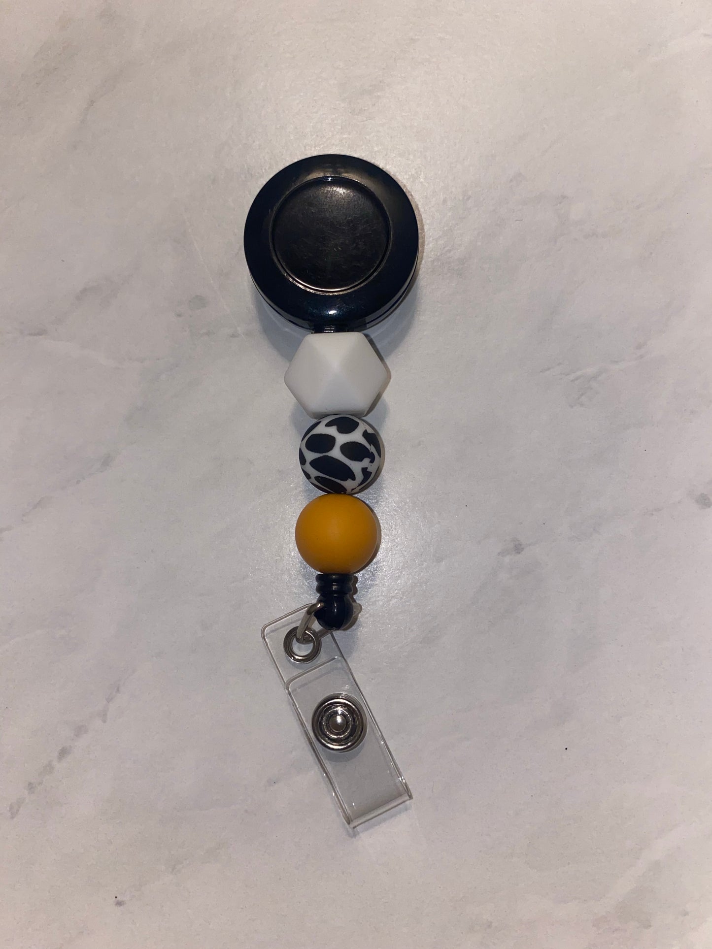 Tangerine Cow Badge Reel