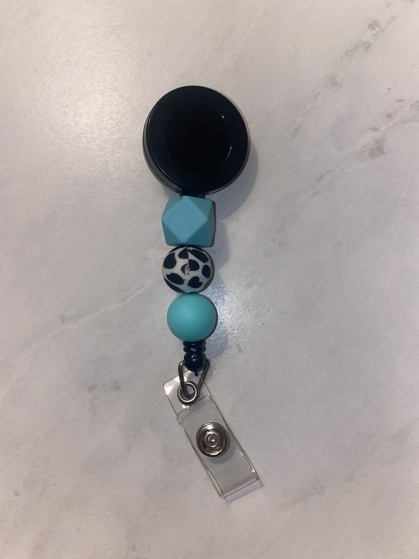 Blue Cow Badge Reel